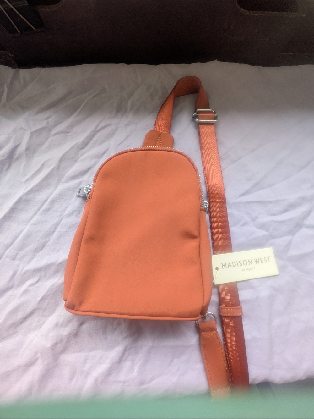 Madison West Orange Mini Sling Backpack